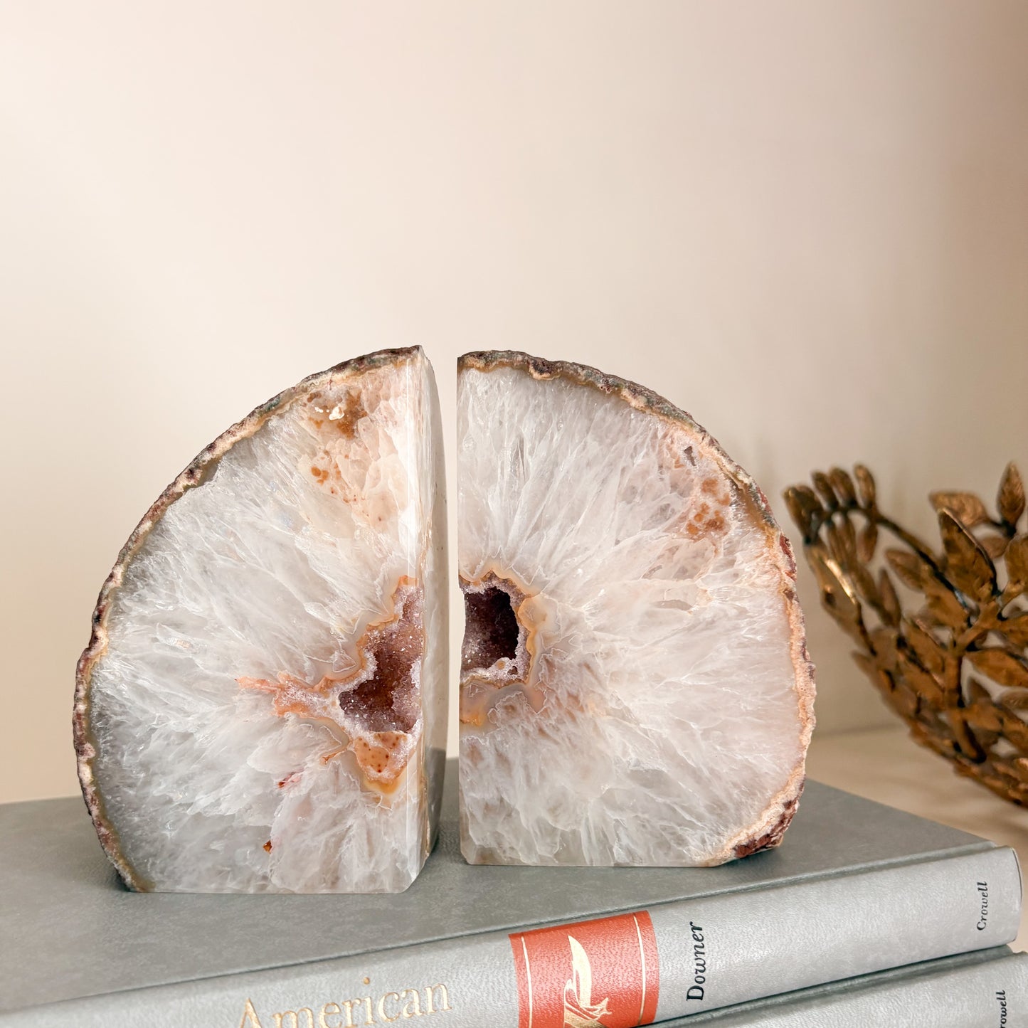 Statement bookshelf decor featuring Brazilian agate druzy geode bookends