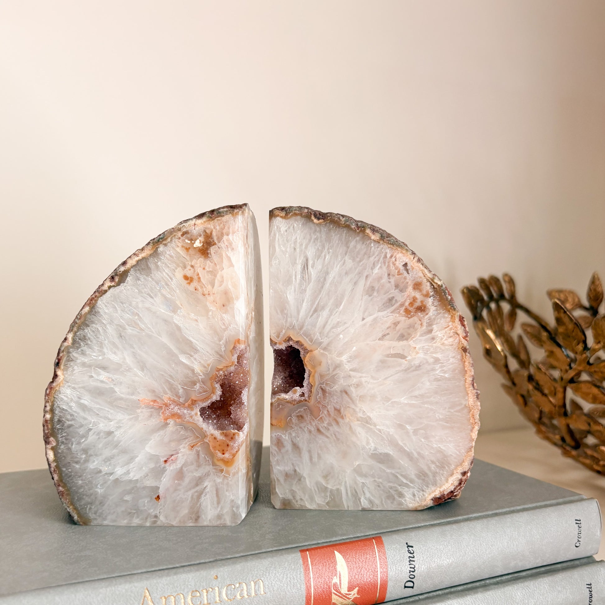 Statement bookshelf decor featuring Brazilian agate druzy geode bookends