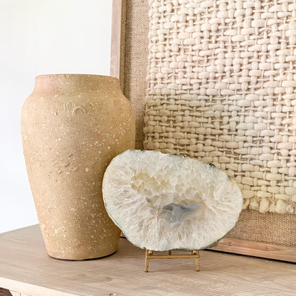 Brazilian agate slab styled on modern console table as luxury décor accent
