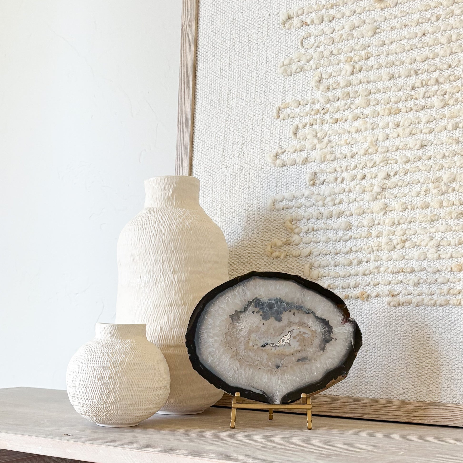 Brazilian agate slice on metal stand, natural crystal home decor accent with vibrant banded patterns