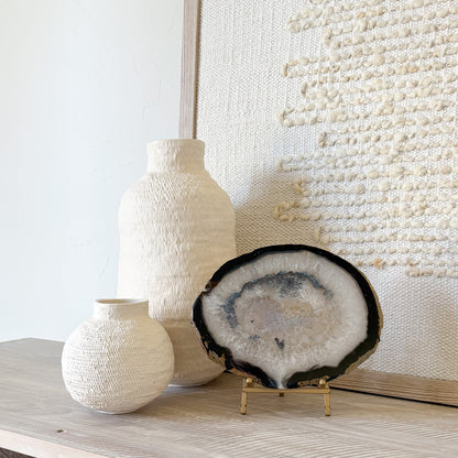 Decorative Brazilian agate slice with natural crystal banding on metal stand