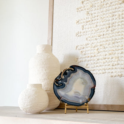 Polished Brazilian agate slice displayed on a brass easel stand, artisanal home decor accent