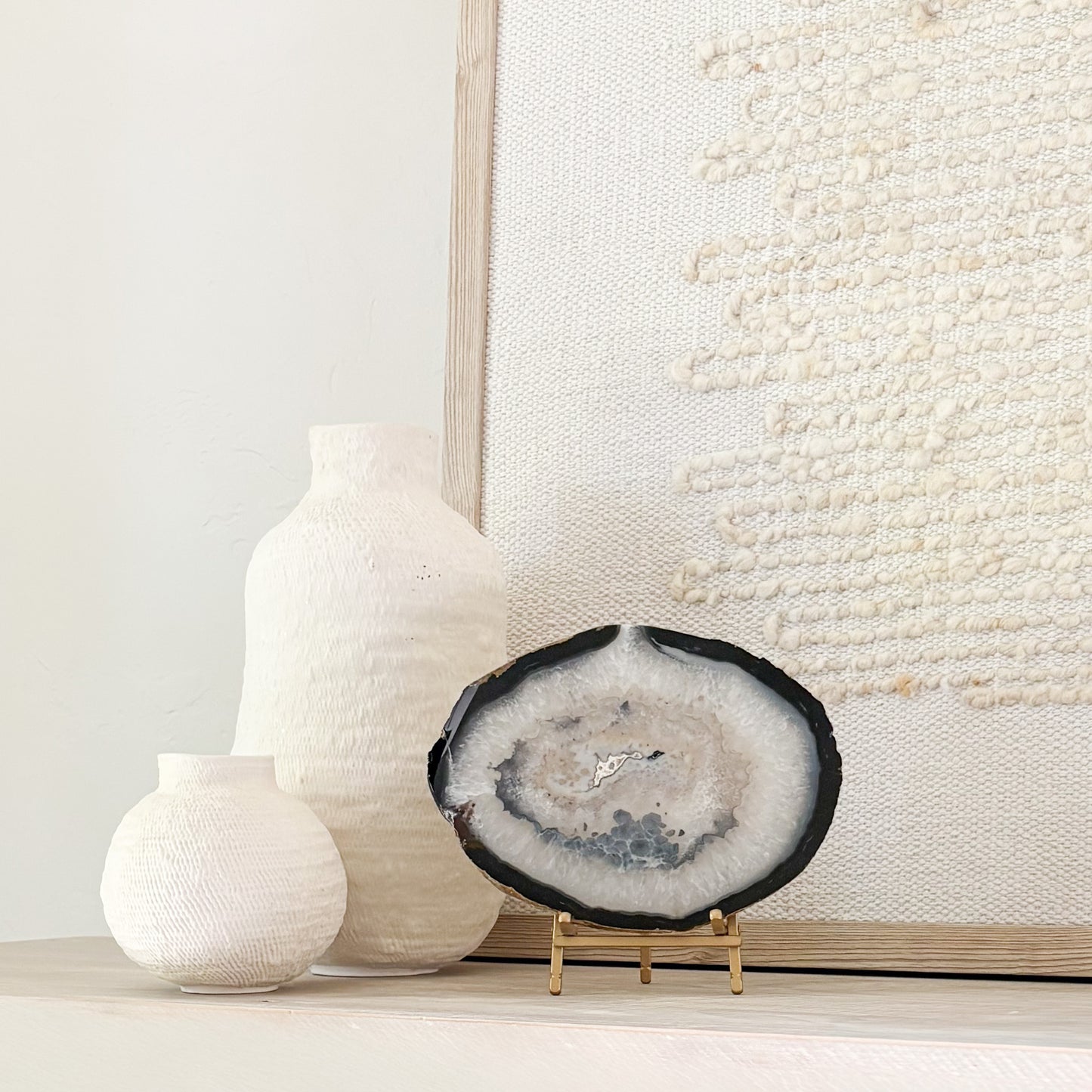 Decorative Brazilian agate slice on stand for modern organic home decor and bookshelf styling