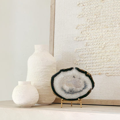 One-of-a-kind Brazilian agate slice displayed on a modern metal stand for shelf styling