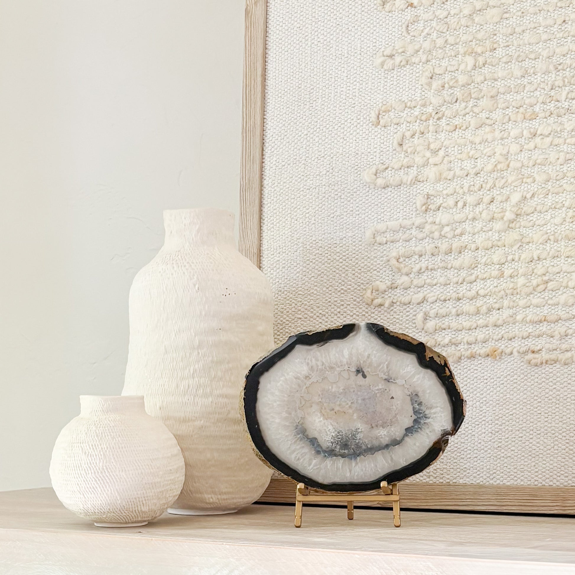 Natural Brazilian agate slice sculpture on stand with unique mineral patterns and organic texture