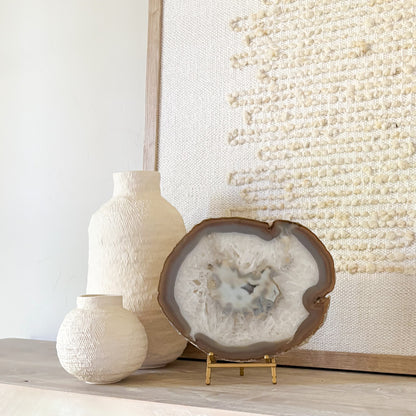 Polished agate slice from Brazil on stand modern luxury interior styling
