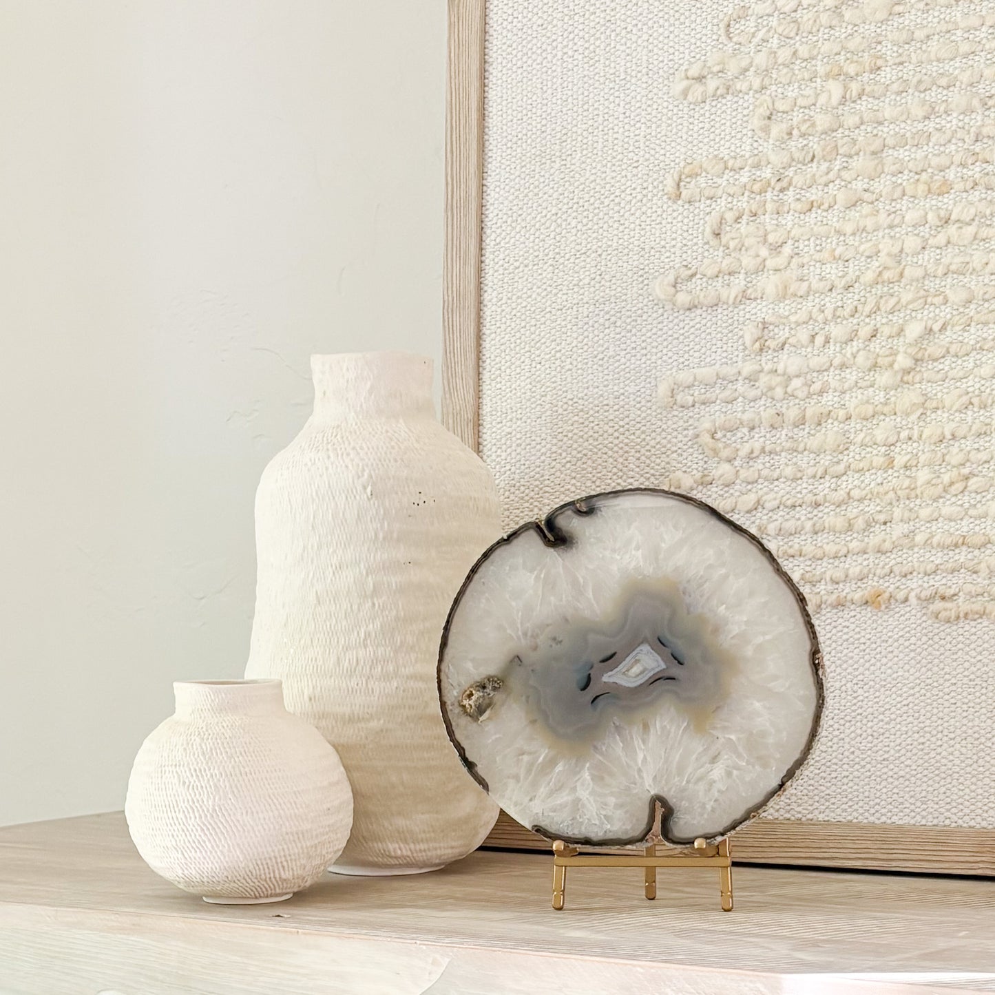 Premium Brazilian agate slice display piece on stand with vibrant crystal patterns and polished finish.