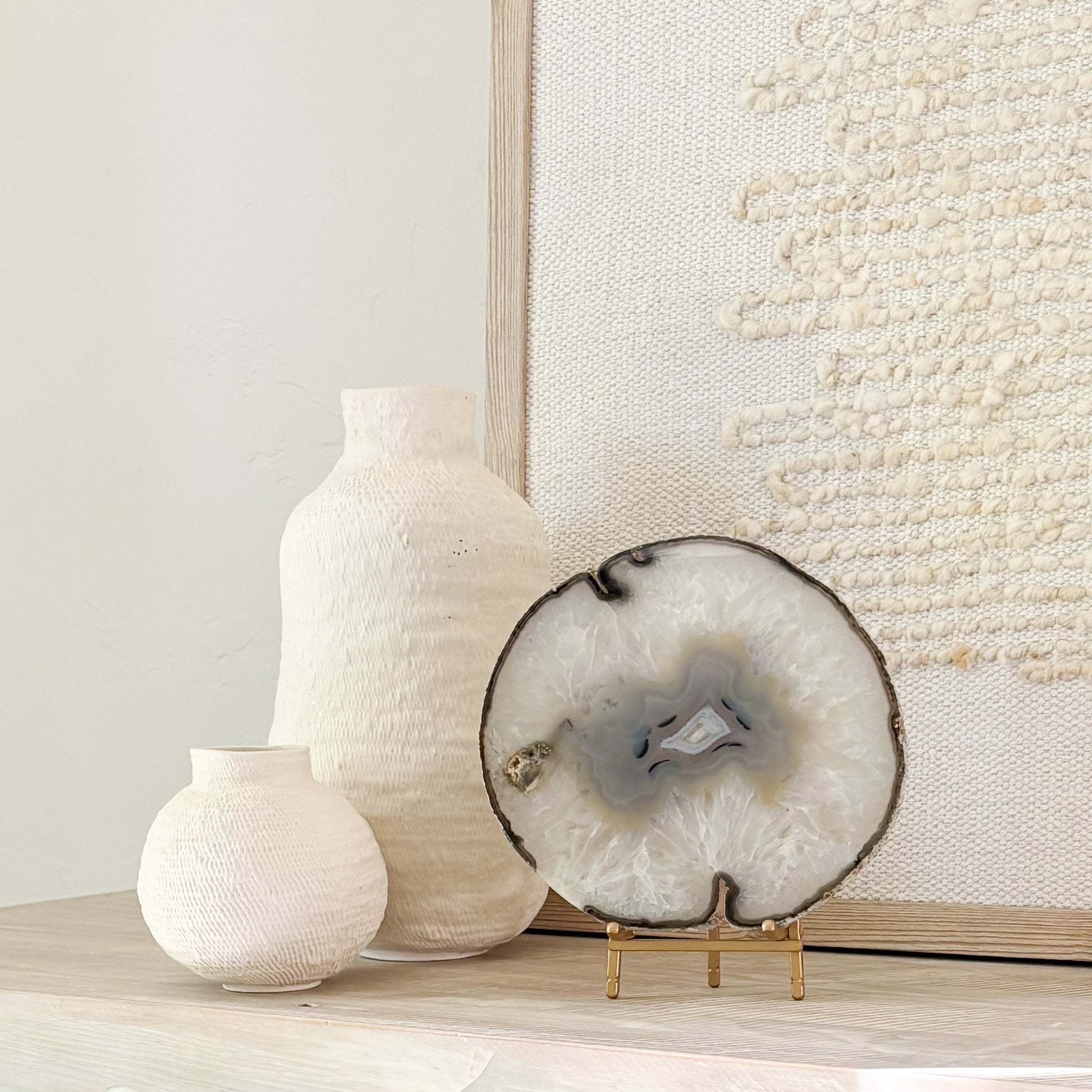 Premium Brazilian agate slice display piece on stand with vibrant crystal patterns and polished finish.