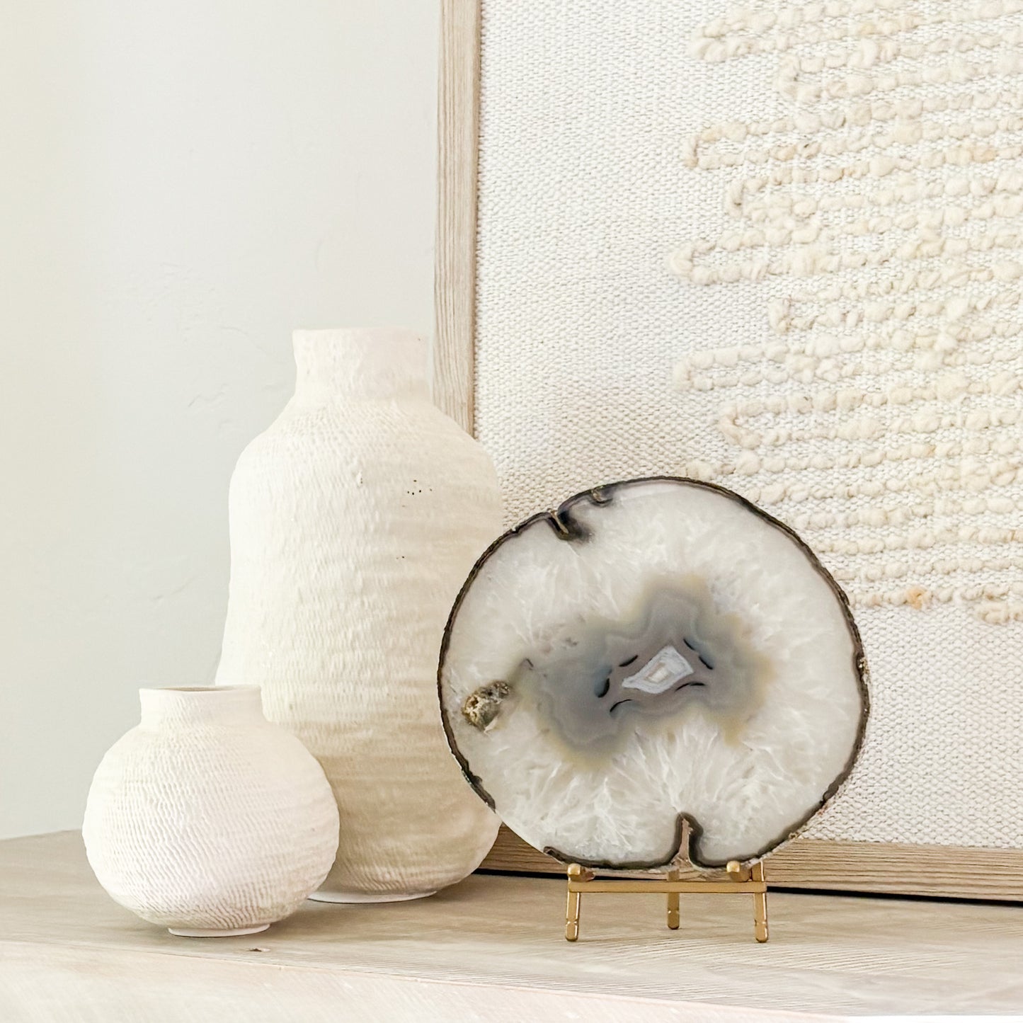 Elegant Brazilian agate geode slice on stand serving as a unique luxury home décor centerpiece.