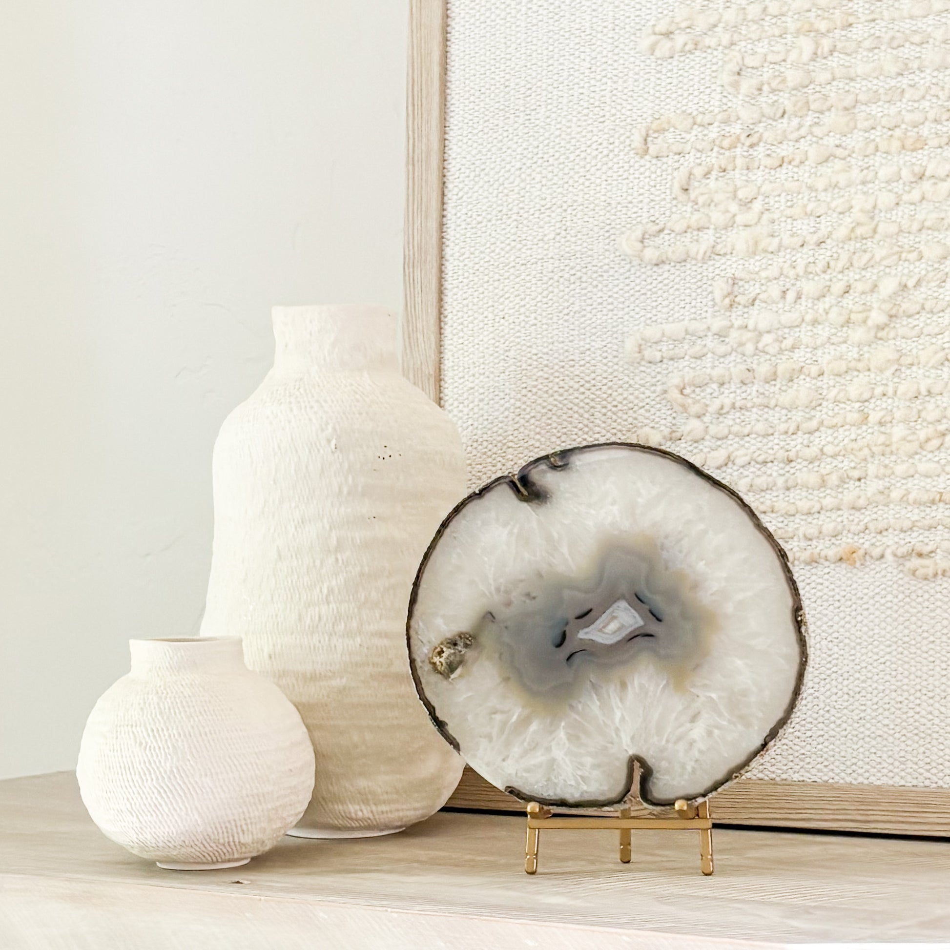 Elegant Brazilian agate geode slice on stand serving as a unique luxury home décor centerpiece.