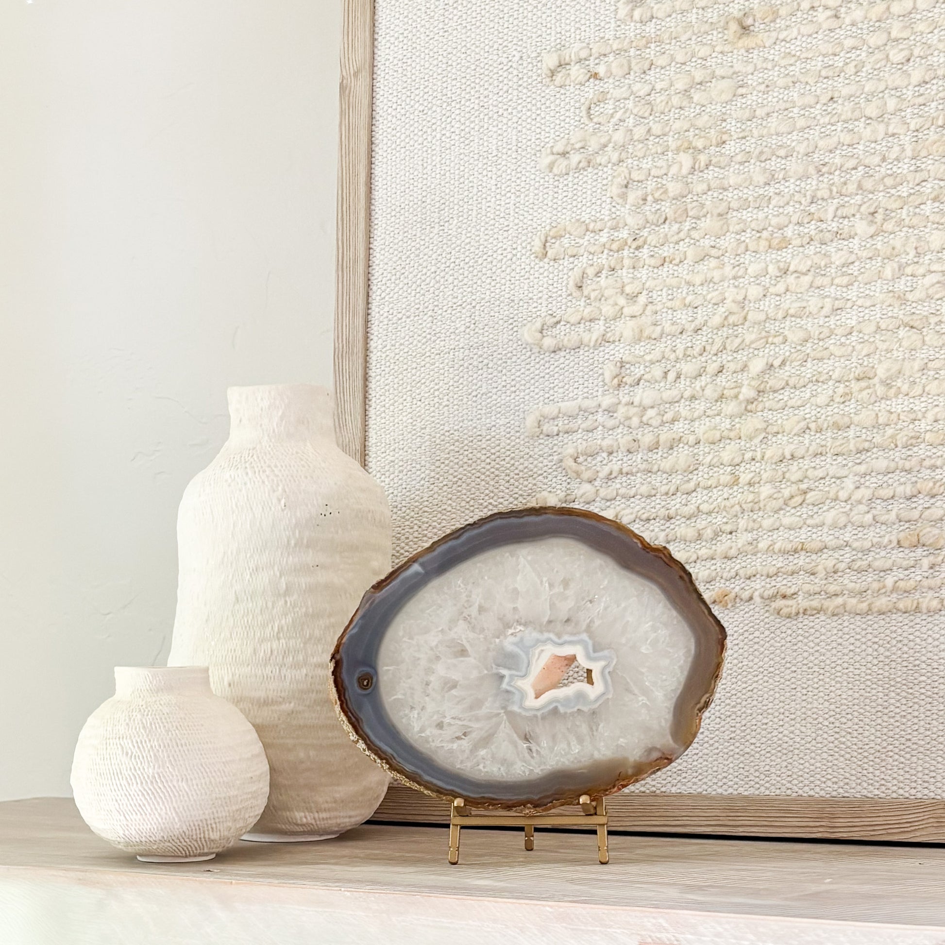 Natural Brazilian agate gemstone slice mounted on stand, perfect for luxury shelf and tabletop décor.