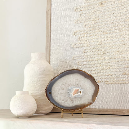 Natural Brazilian agate gemstone slice mounted on stand, perfect for luxury shelf and tabletop décor.