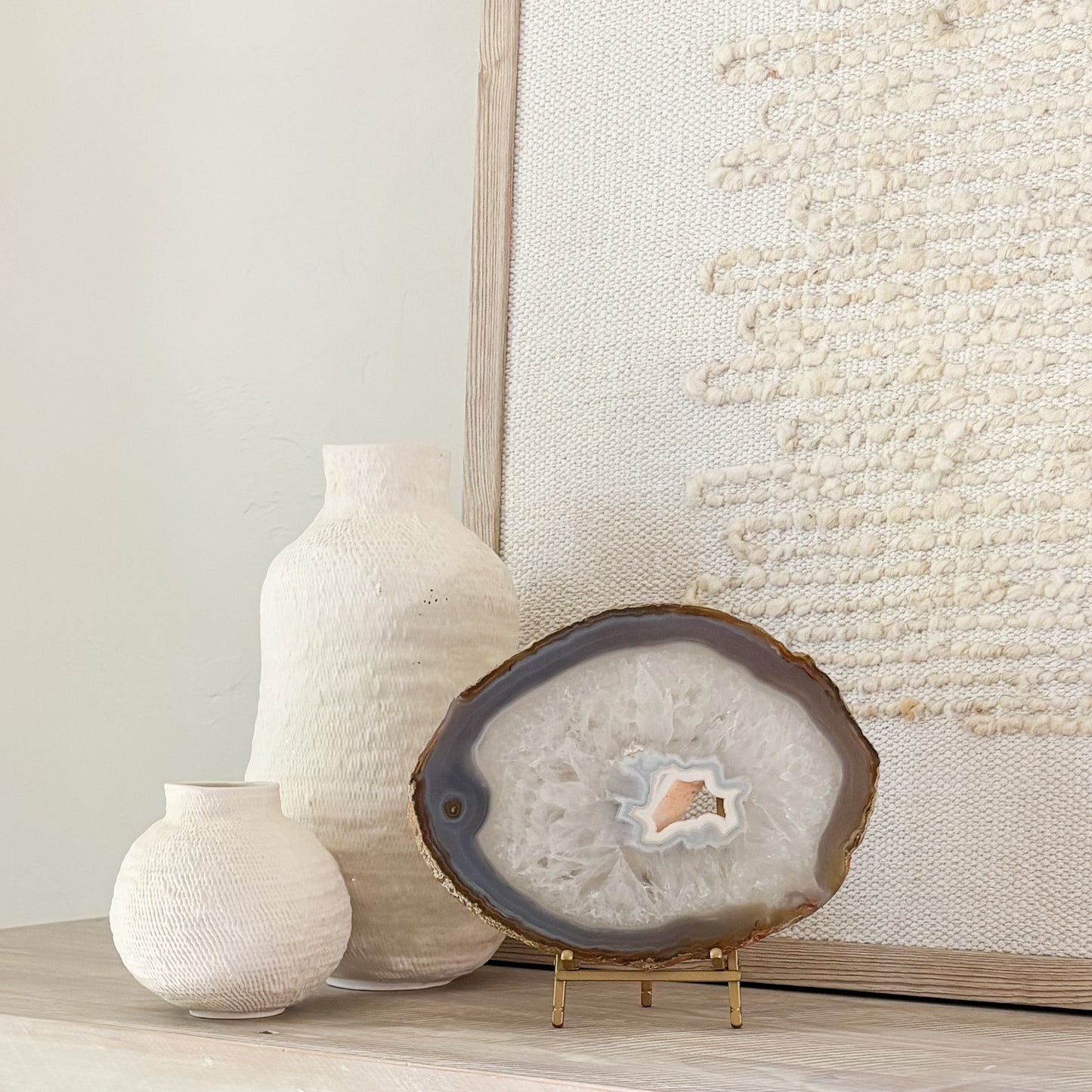 Decorative Brazilian agate crystal slice on stand adding natural beauty and sophistication to interior spaces.