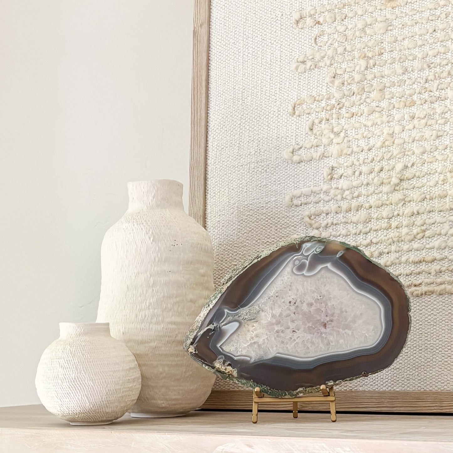 Premium Brazilian agate slice display piece on stand with vibrant crystal patterns and polished finish.