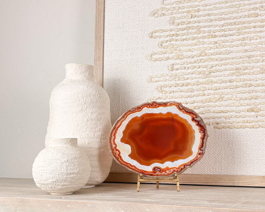 “Natural Brazilian agate slice on stand with polished crystal bands and unique gemstone patterns"