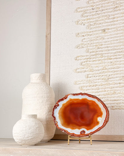 “Polished Brazilian agate crystal decor on stand with one-of-a-kind natural stone patterns.”