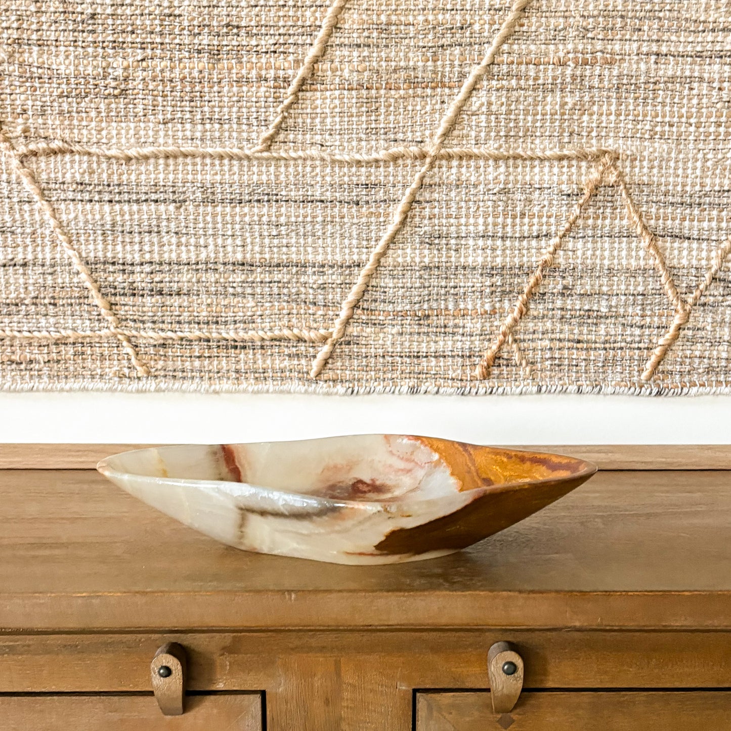 Hand carved large brown onyx bowl, natural stone decorative centerpiece on wood table, modern home decor