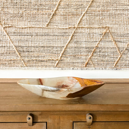 Hand carved large brown onyx bowl, natural stone decorative centerpiece on wood table, modern home decor