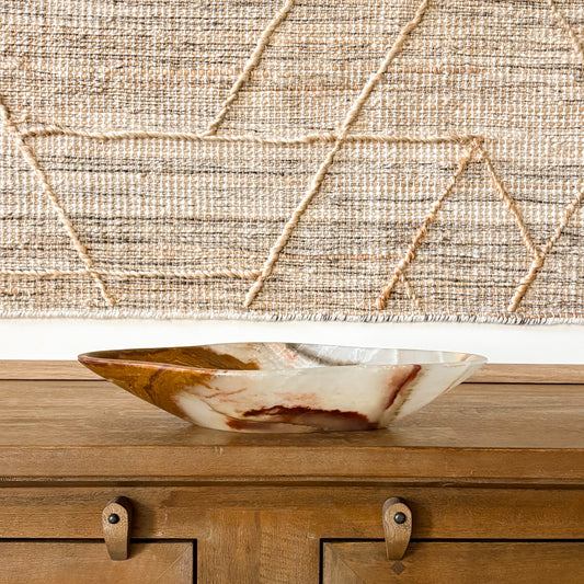 Hand carved large brown onyx bowl with natural stone patterns, polished decorative centerpiece
