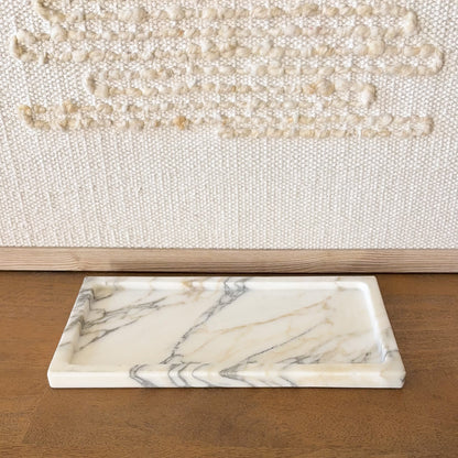 Angled view of Calacatta Vagli marble tray with natural gray veining