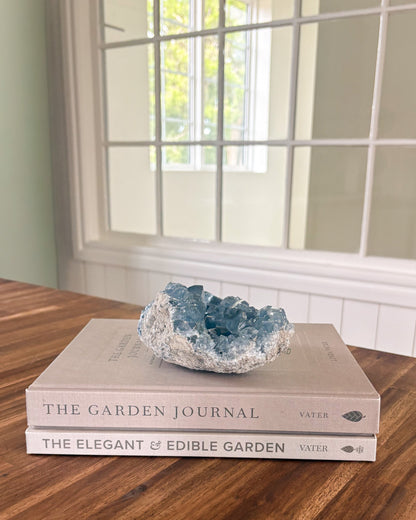tite mineral specimen with sparkling blue crystals