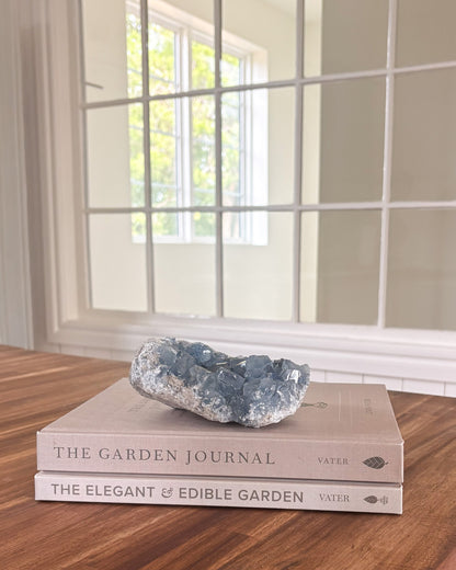 Natural celestite mineral cluster with soft blue crystal formation