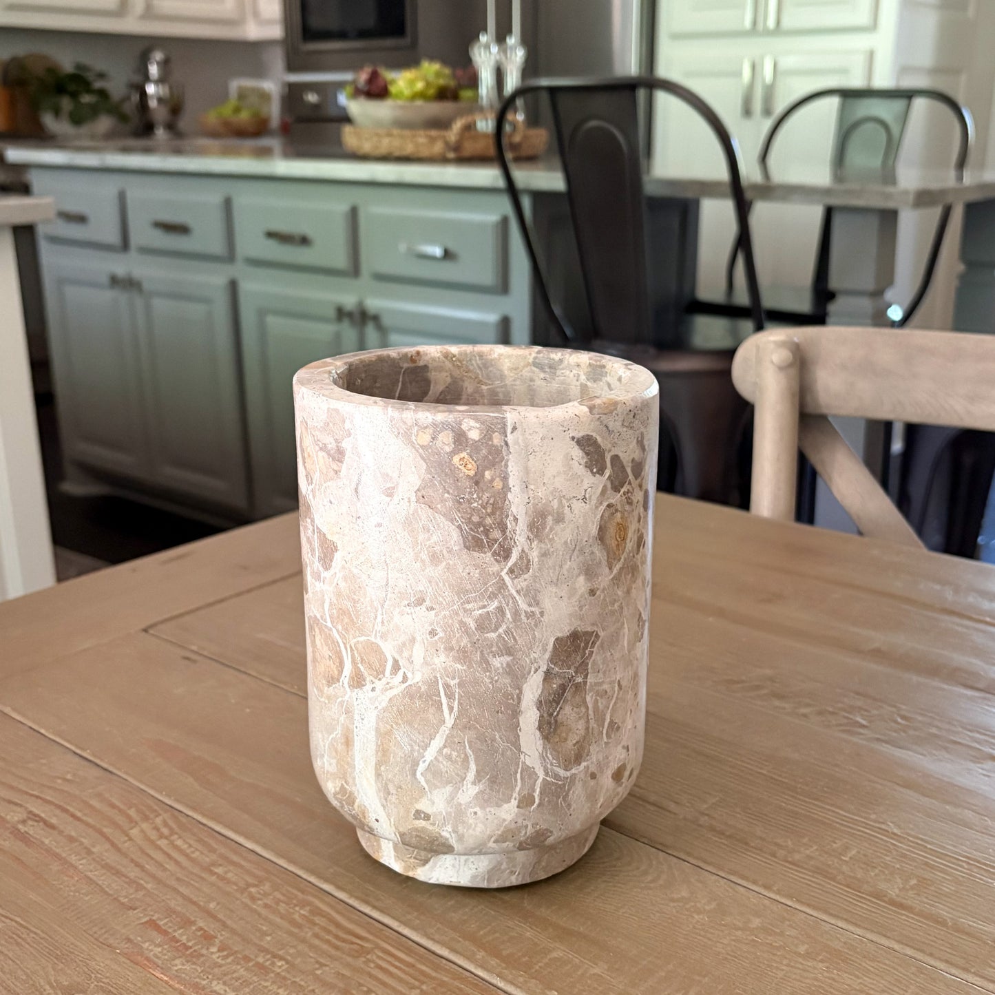 Luxury kitchen entertaining accessory featuring a marble wine bottle cooler
