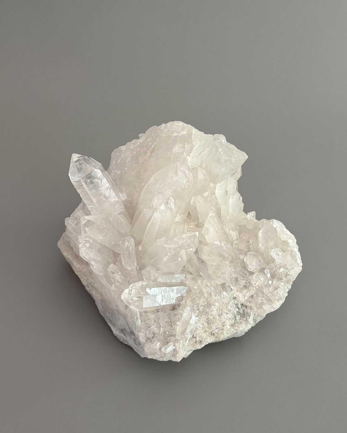 One-of-a-kind clear quartz cluster with intricate crystal formations and natural mineral texture.