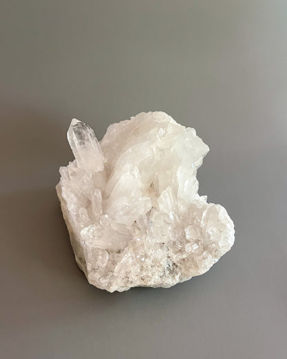 Clear quartz crystal cluster showcasing varied crystal sizes, translucent surfaces, and natural details.