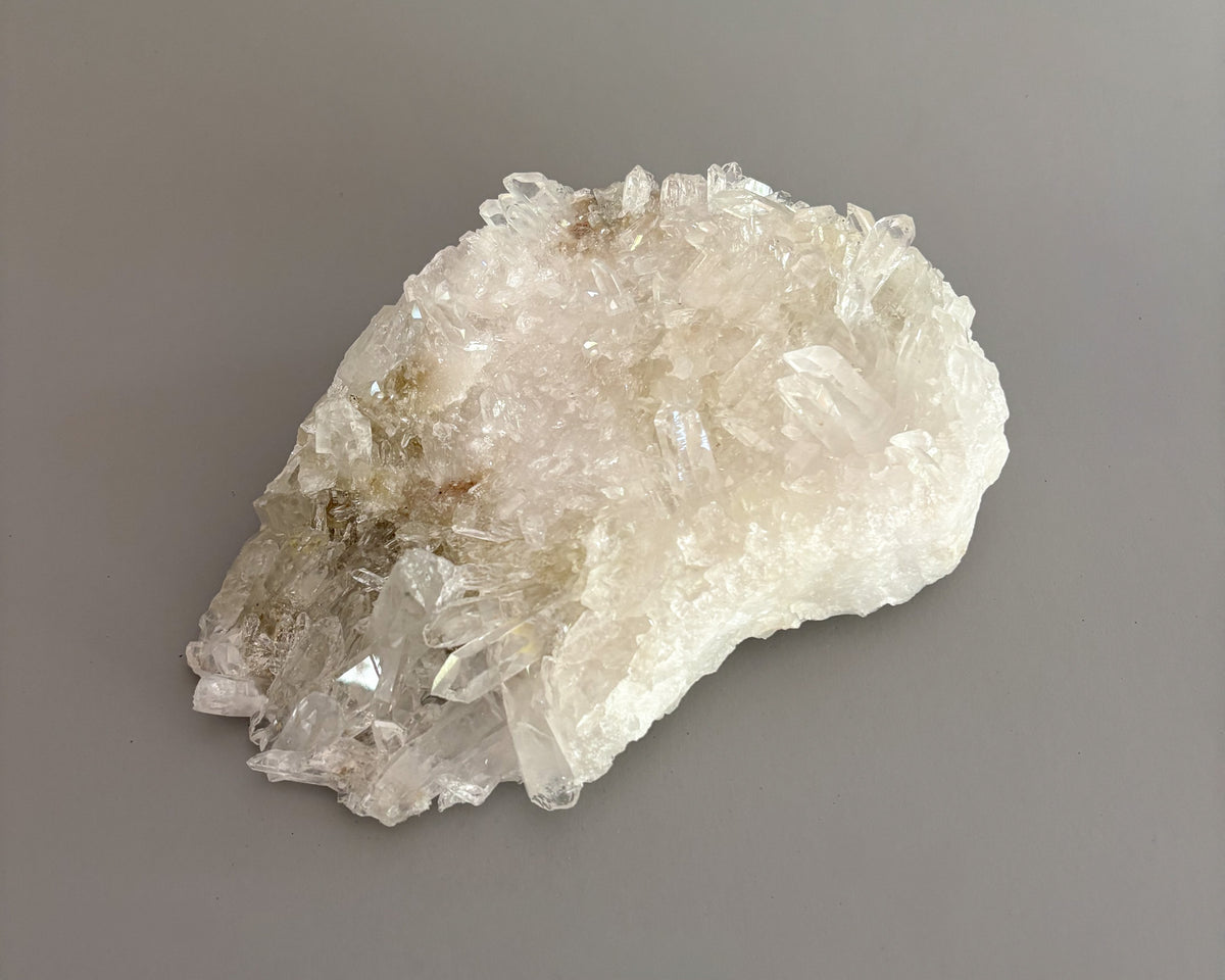 One-of-a-kind clear quartz cluster with intricate crystal formations and natural mineral texture.