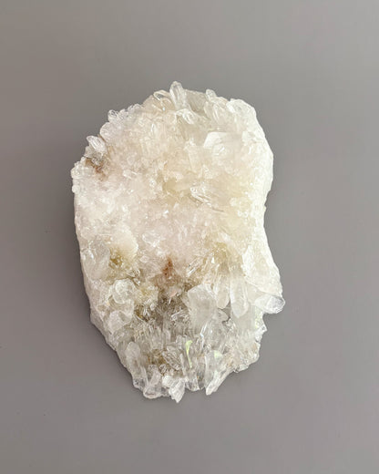 One-of-a-kind clear quartz cluster with intricate crystal formations and natural mineral texture.