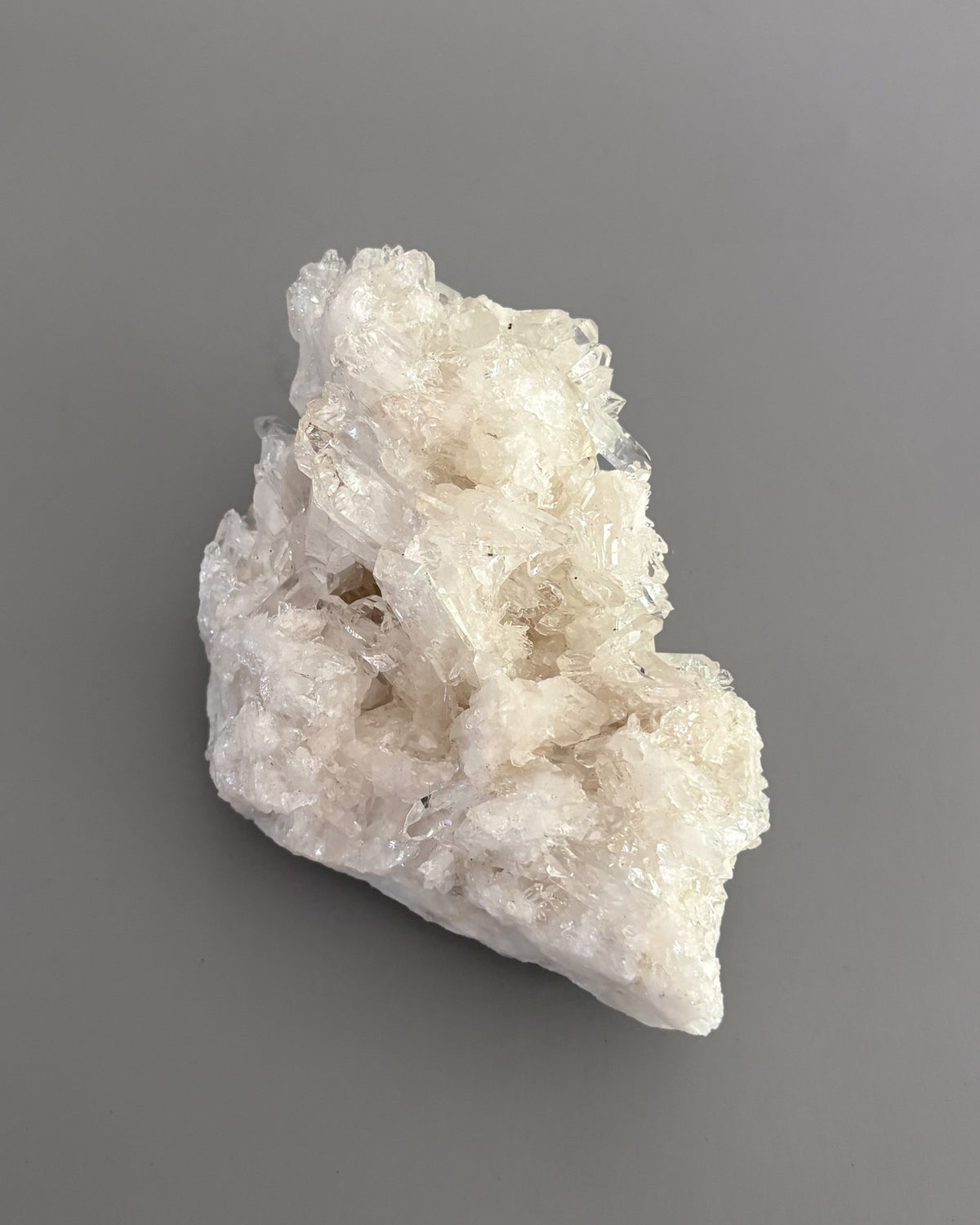 Clear quartz crystal cluster showcasing varied crystal sizes, translucent surfaces, and natural details.