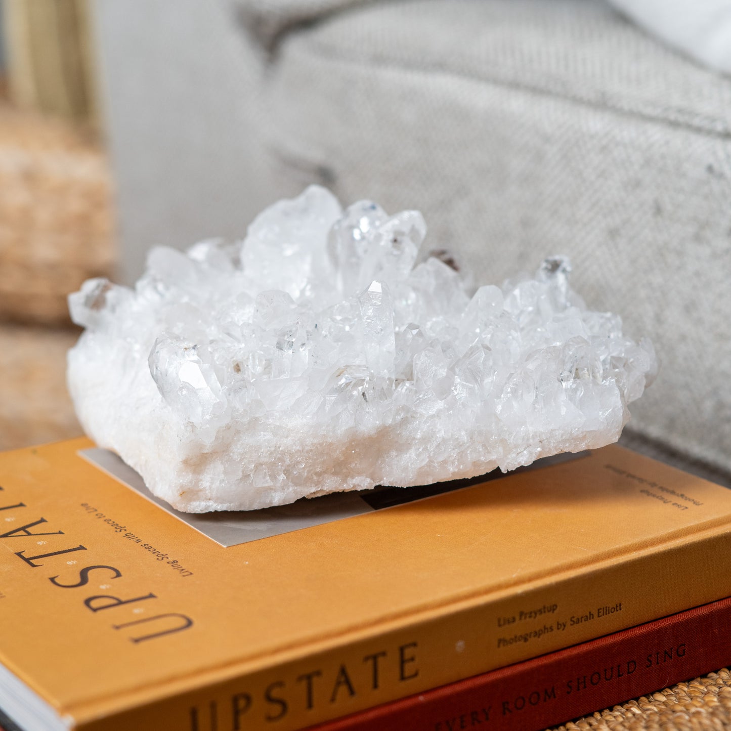 Large natural clear quartz crystal cluster showcasing brilliant transparent crystal formations for luxury home decor