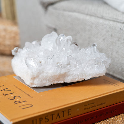 Large natural clear quartz crystal cluster showcasing brilliant transparent crystal formations for luxury home decor
