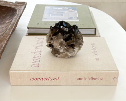 Raw smoky quartz crystal cluster with translucent brown quartz points