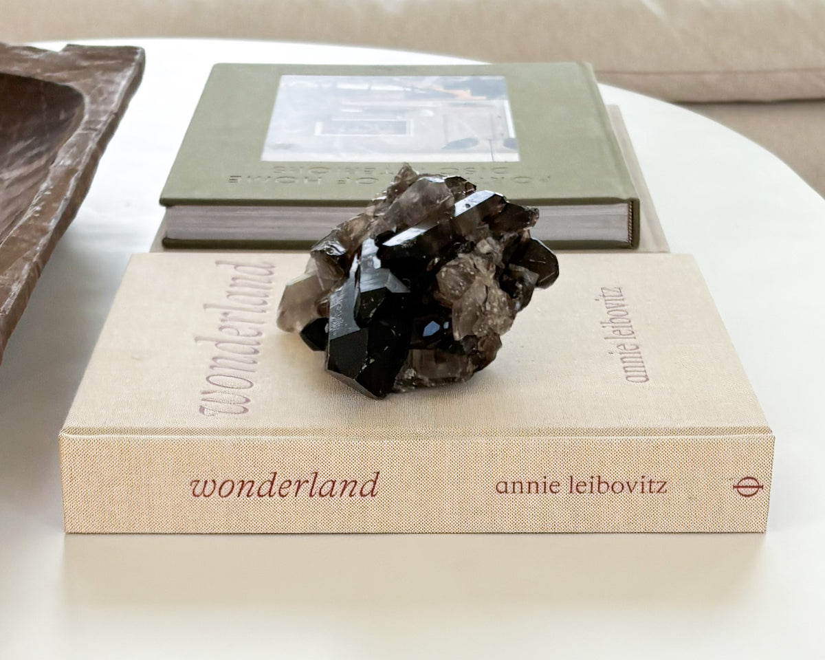 Raw smoky quartz crystal cluster with translucent brown quartz points