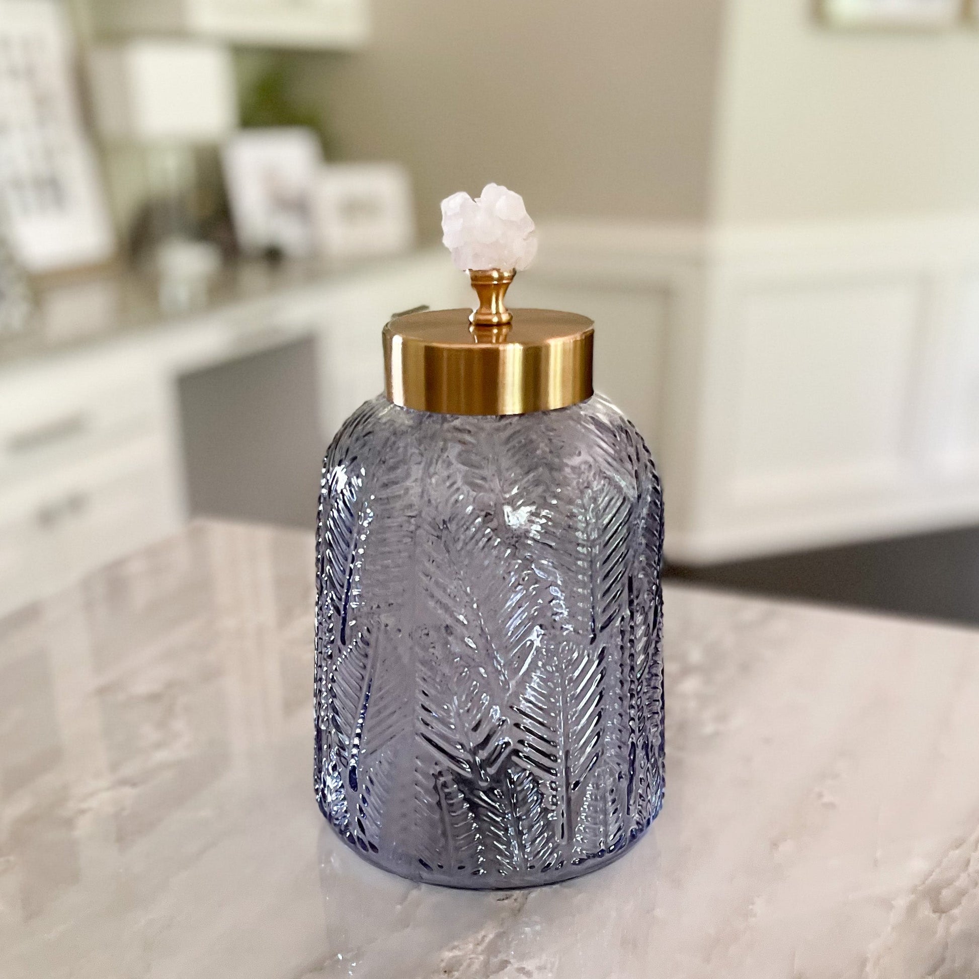 blue-grey textured glass canister with brass lid