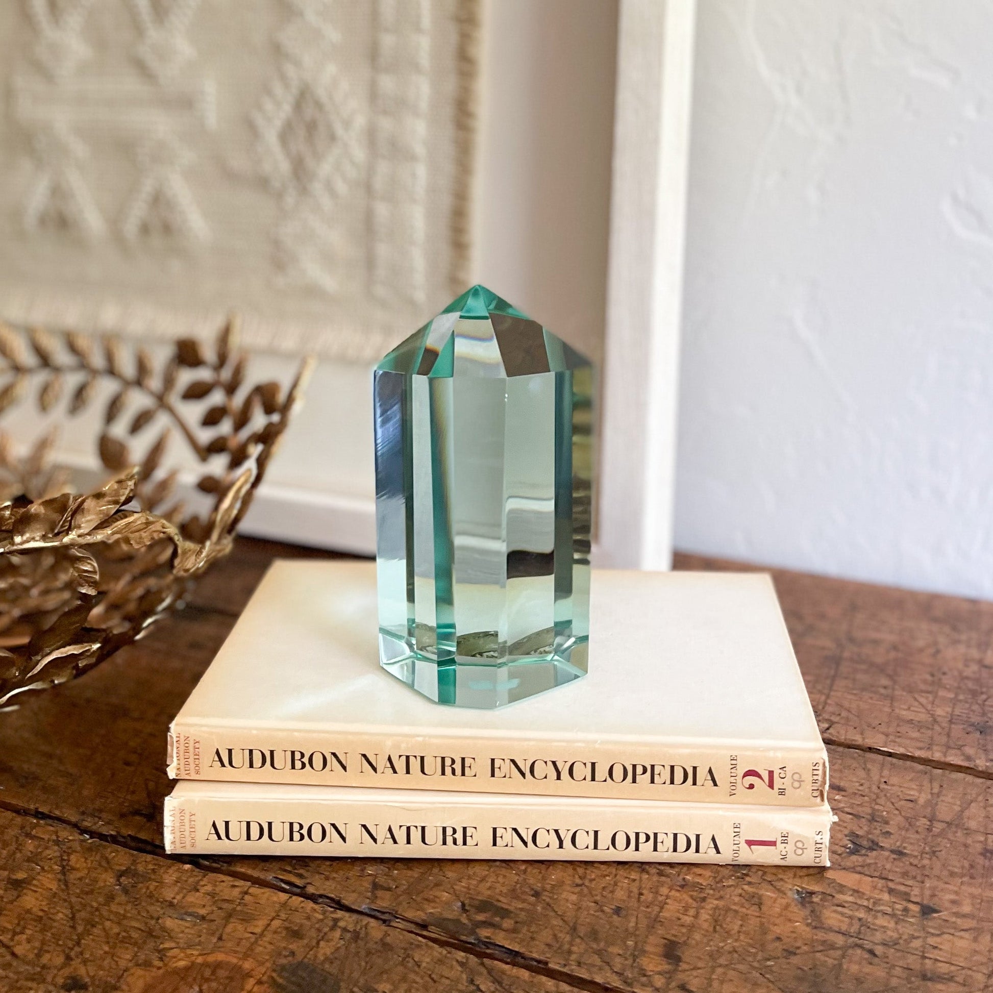 green glass booksheld decor