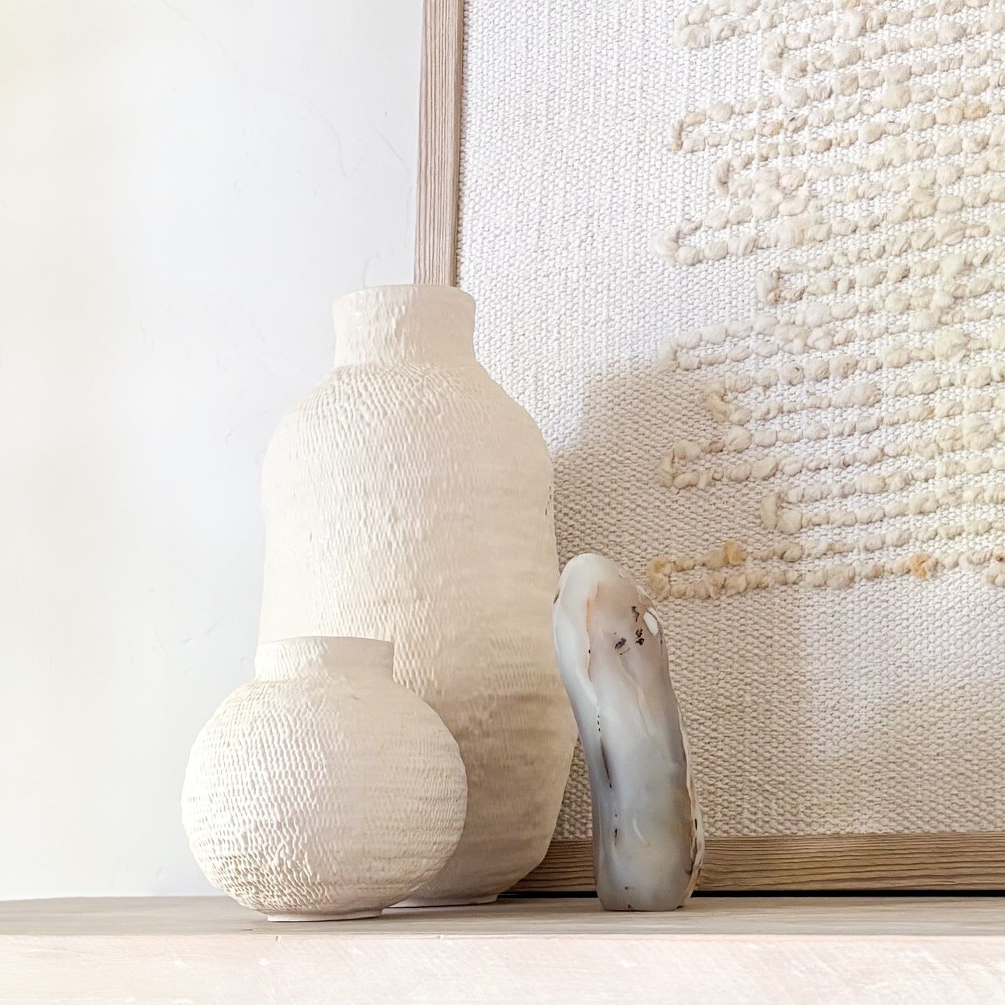 Natural stone sculpture decor featuring Madagascar fern agate in wabi-sabi interior styling