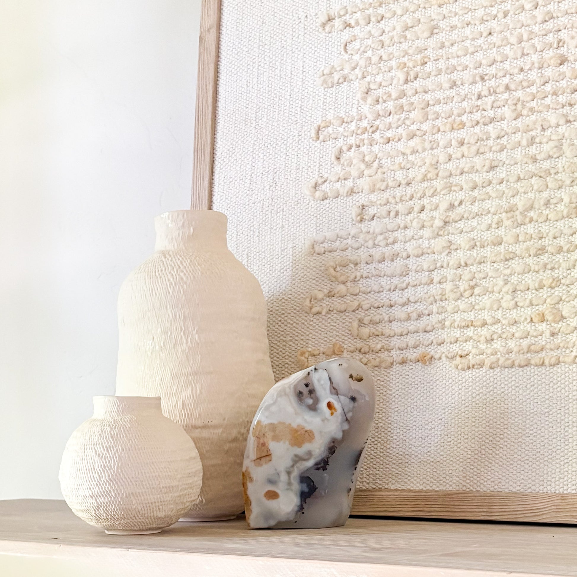 Polished Madagascar moss agate stone with abstract natural patterns in minimalist home setting