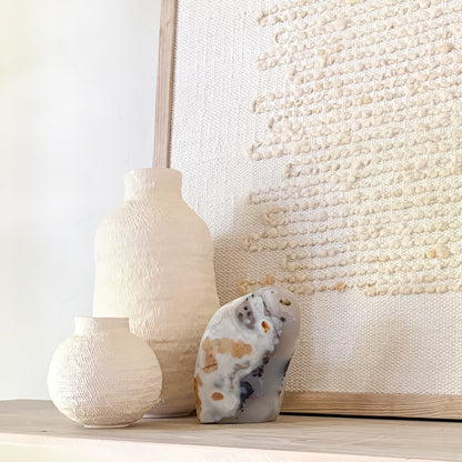 Polished Madagascar moss agate stone with abstract natural patterns in minimalist home setting