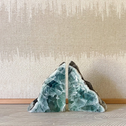 Fluorite stone bookends with organic textures in a refined minimalist setting