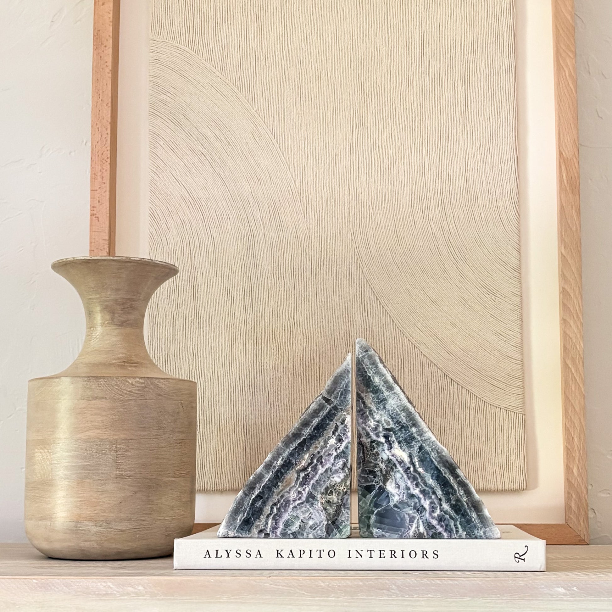 Natural fluorite bookend pair styled in a home office library