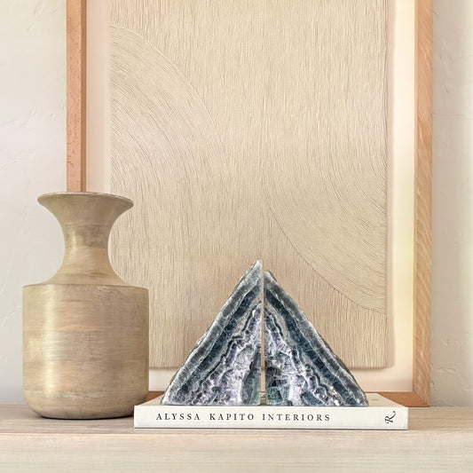 Rainbow fluorite gemstone bookends displaying purple and green crystal bands
