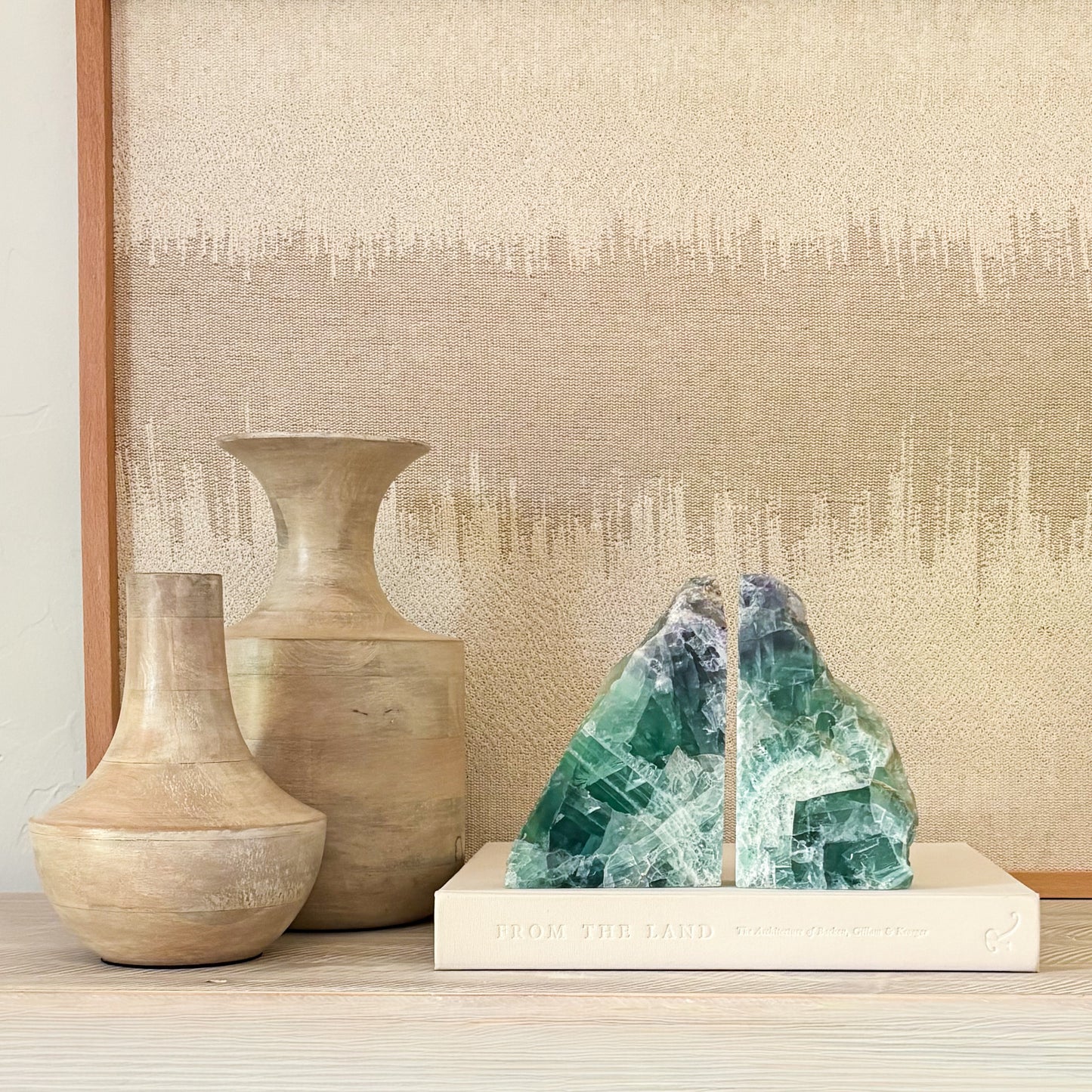 Handcrafted fluorite bookend pair displaying translucent purple and green crystal formations