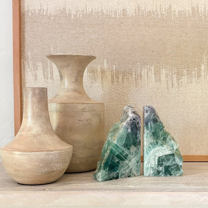 Matching fluorite crystal bookends with striking natural color variations and mineral banding