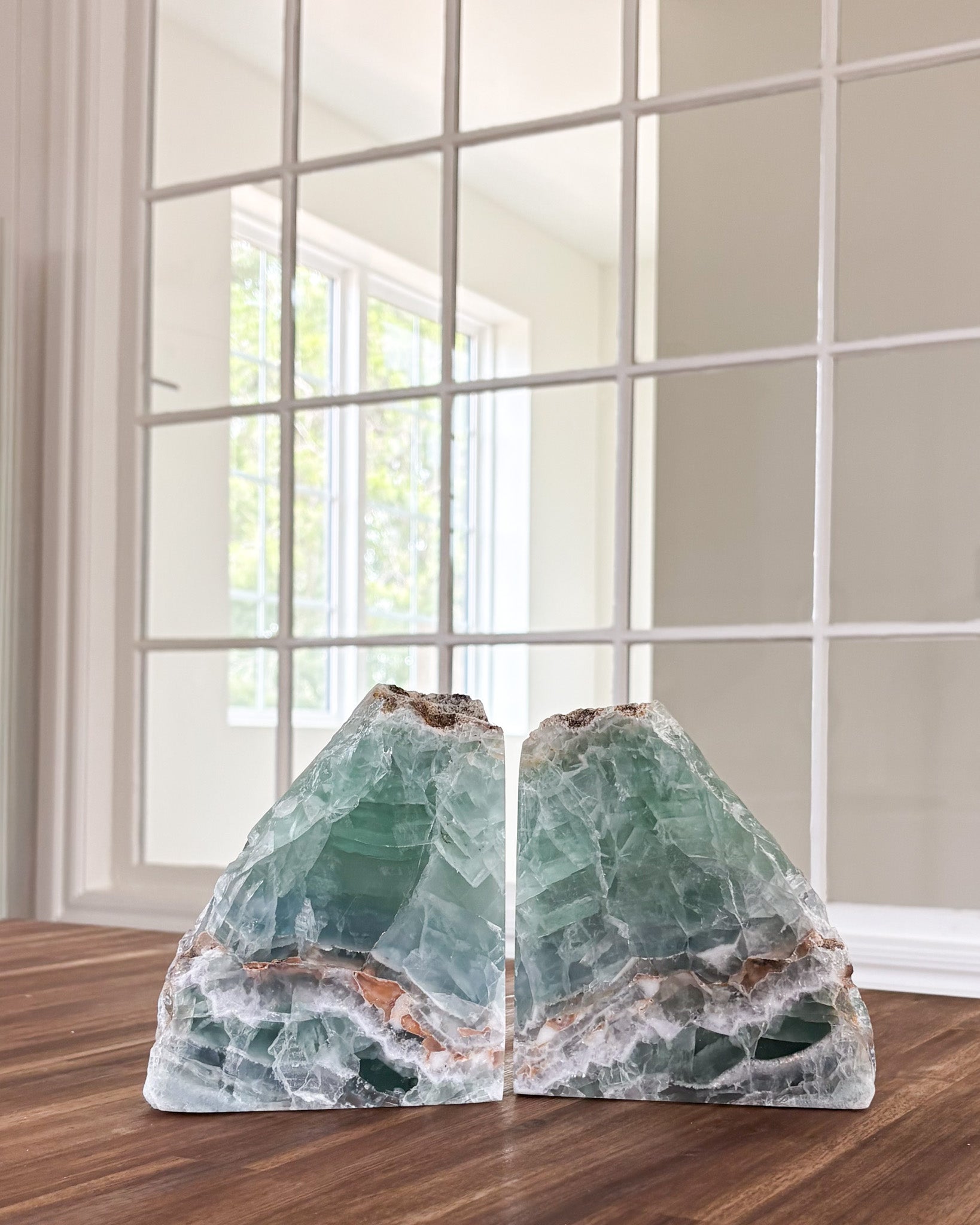 Natural fluorite bookends with translucent green and purple crystal detail