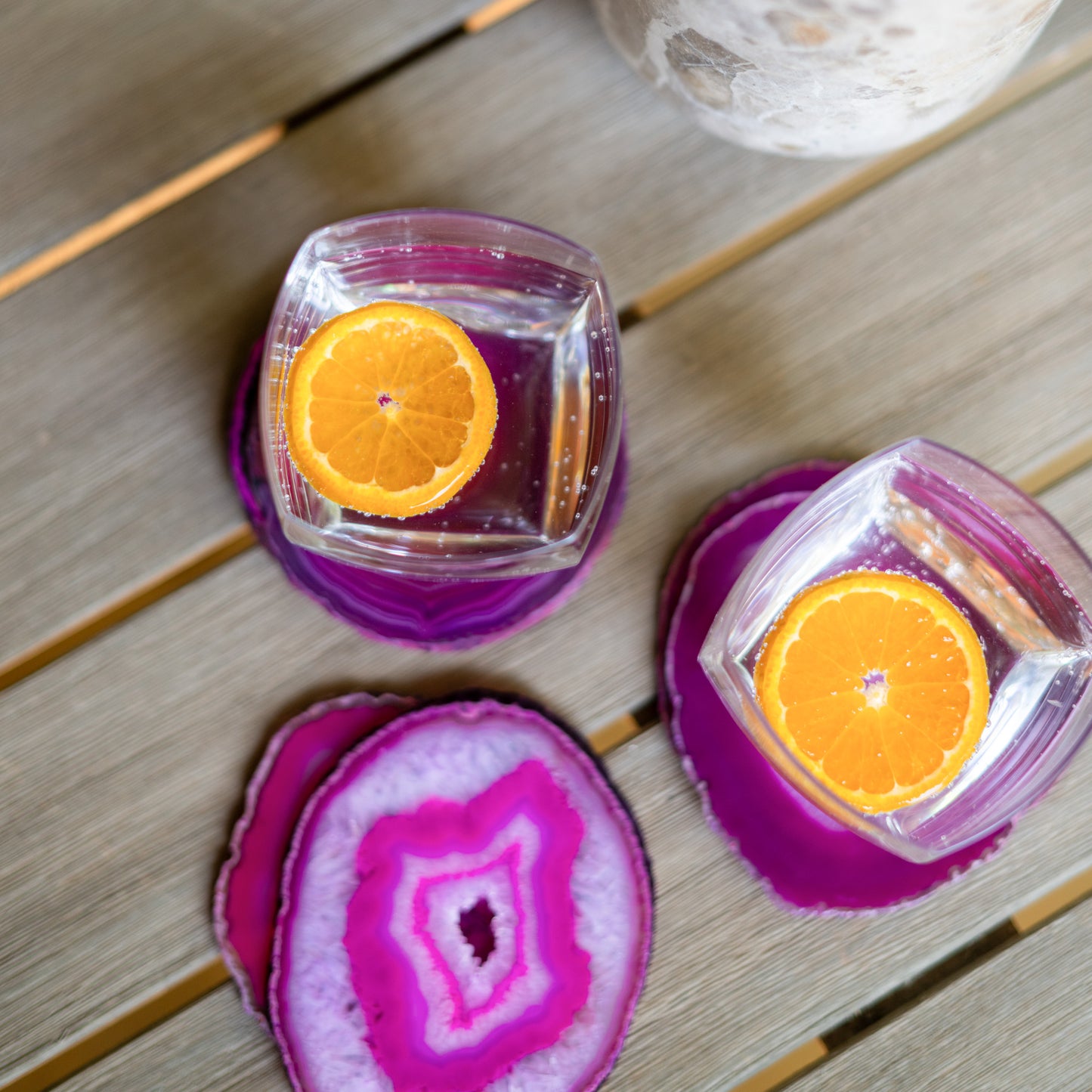 Polished fuchsia agate drink coasters crafted from genuine natural stone with one-of-a-kind color variations.
