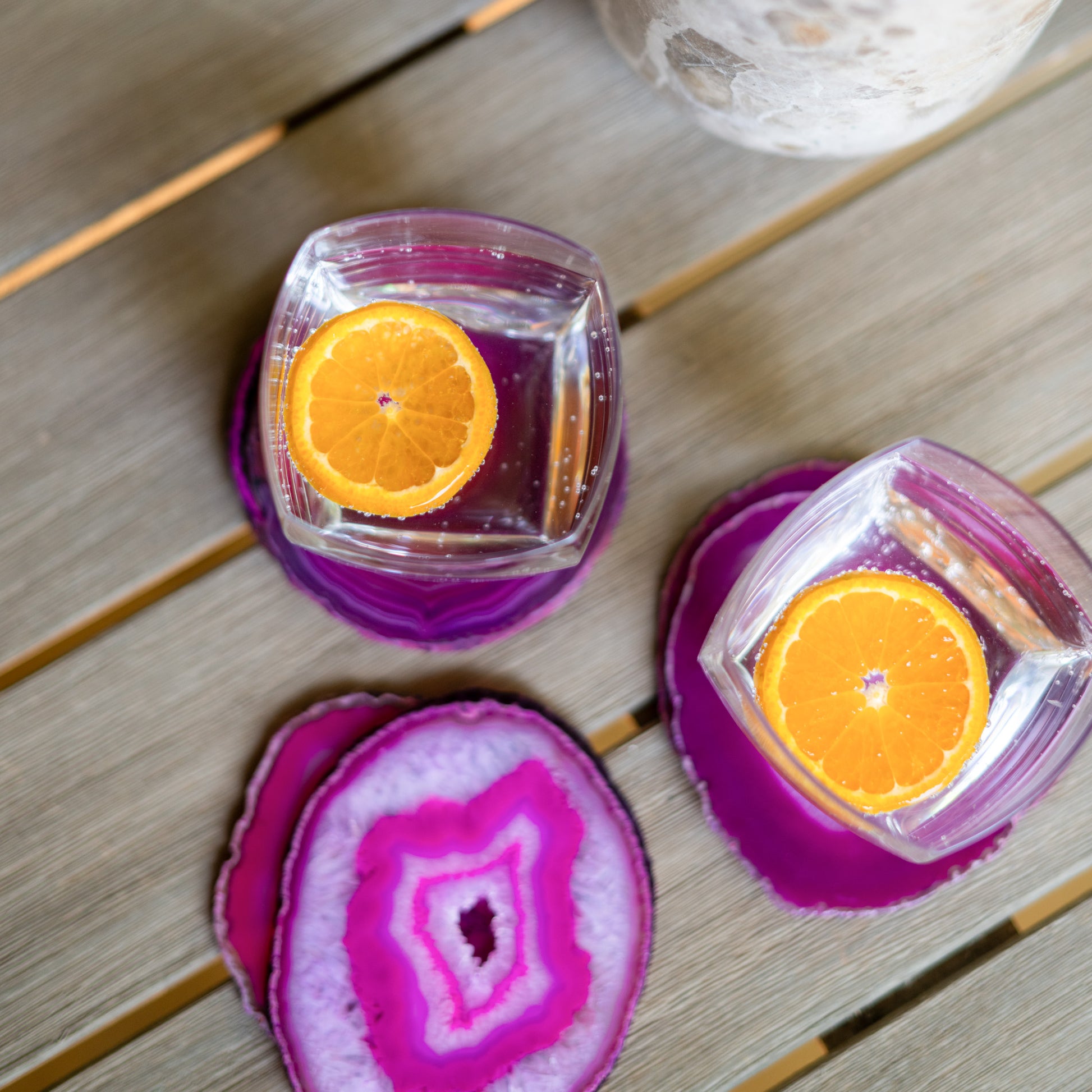 Polished fuchsia agate drink coasters crafted from genuine natural stone with one-of-a-kind color variations.