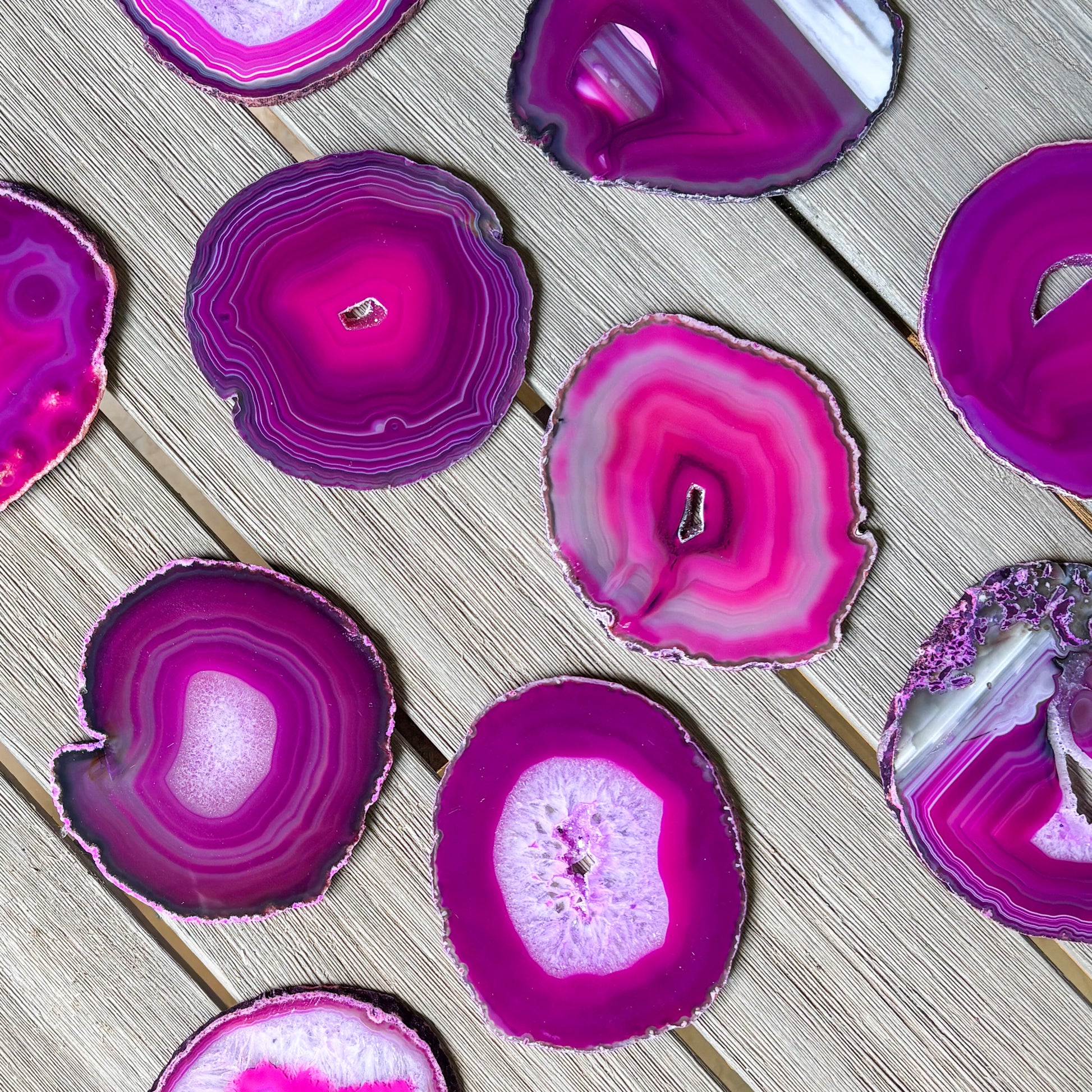 Premium fuchsia agate coaster set with polished natural stone surface and striking organic patterns